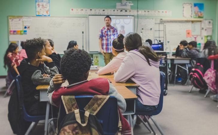 Children listening to teacher in classroom