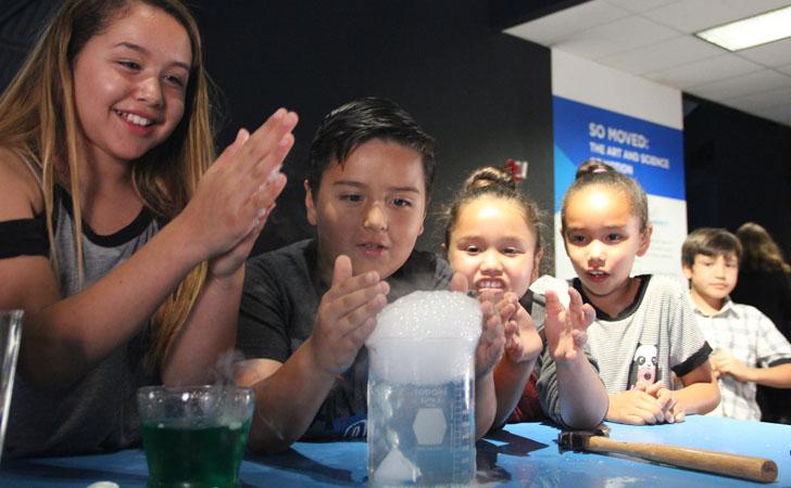 Children watching science experiment